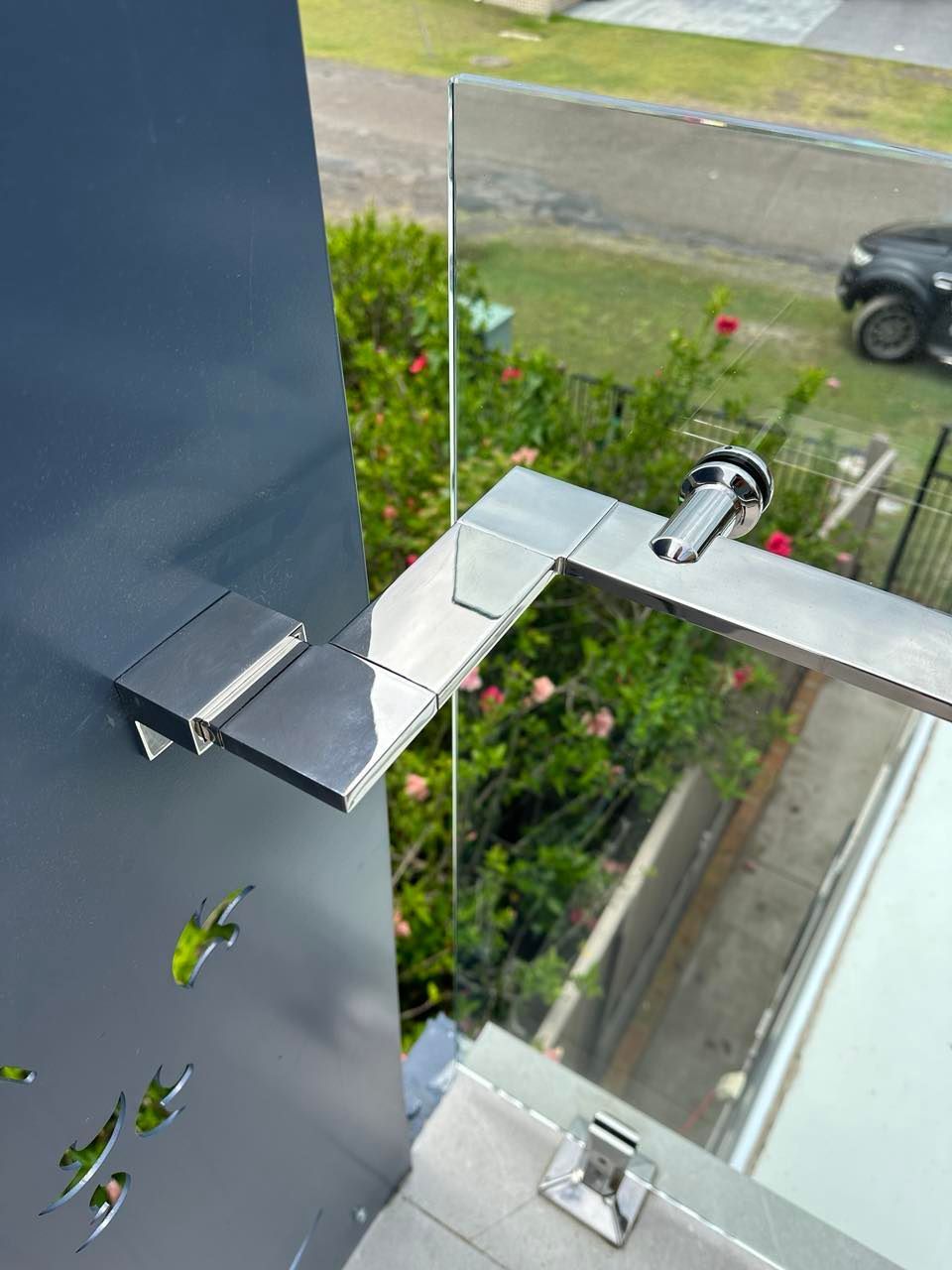 A Balcony with A Stainless Steel Railing and Clear Glass — Coastline Glass Pool Fencing in Old Bar, NSW