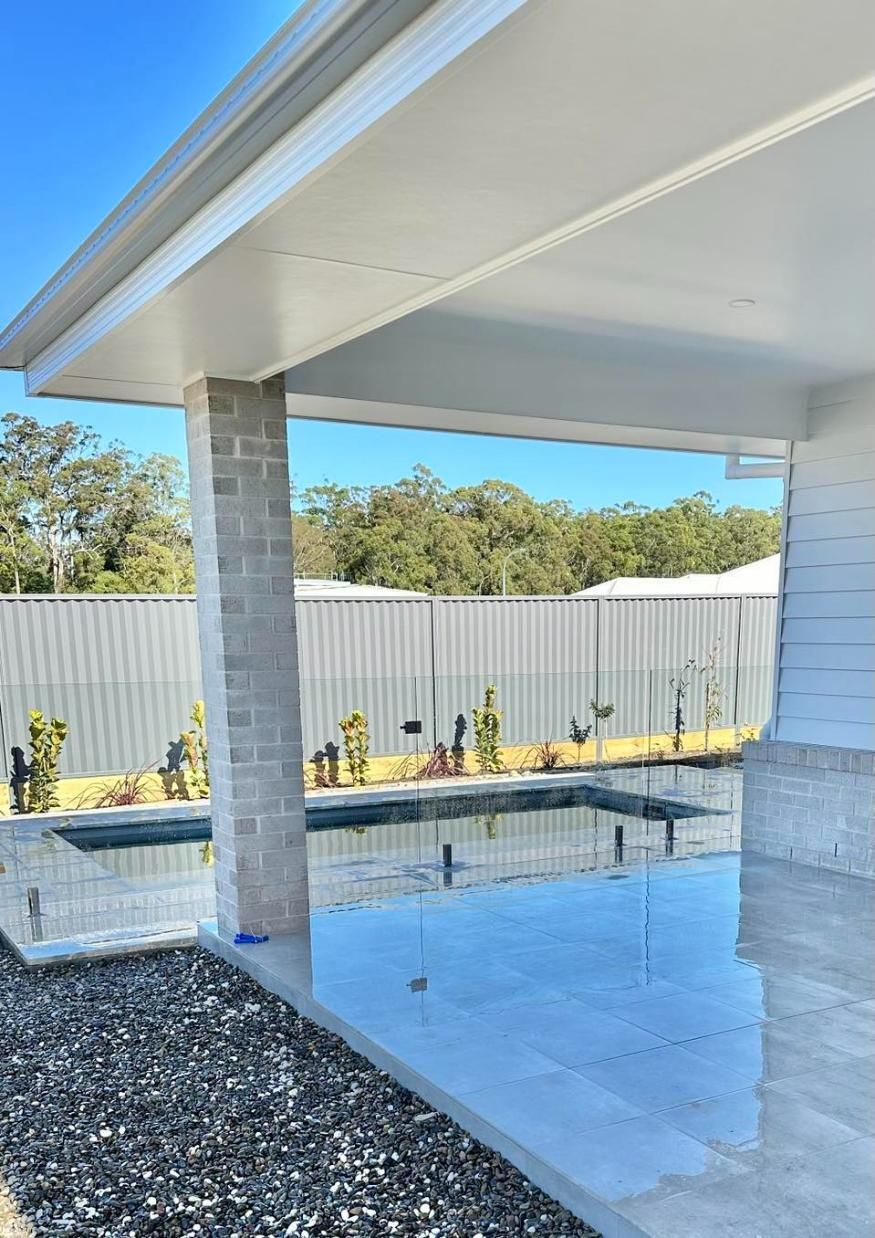 A Pool with A Glass Fence, Viewed from A Covered Patio — Coastline Glass Pool Fencing in Old Bar, NSW