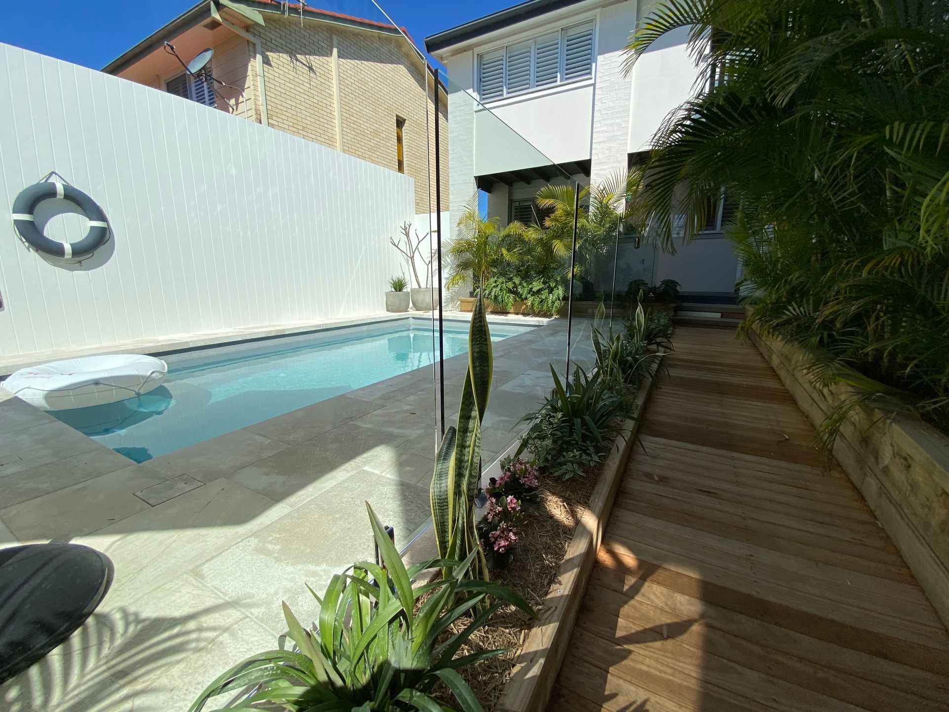 A Glass Railing with A Stainless Steel Handrail on A Bridge — Coastline Glass Pool Fencing in Old Bar, NSW