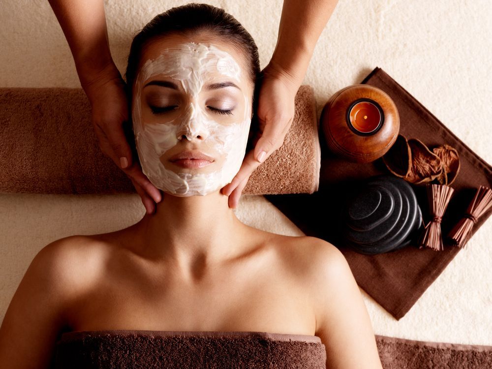 A Woman is Getting a Face Mask at a Spa — Siam Thai Massage In Tweed Heads, NSW
