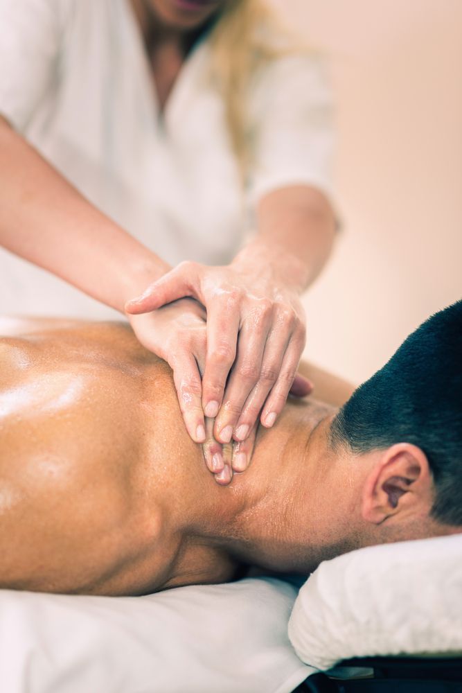 A Man is Getting a Massage at a Spa — Siam Thai Massage In Tweed Heads, NSW