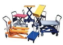 Assorted wheeled lifting carts and tables in orange, blue, red, and yellow.