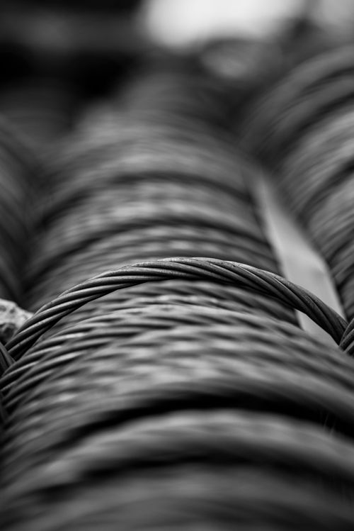 Close-up of coiled black cables with a shallow depth of field