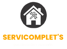 Logotipo de SERVICOMPLET con una casa blanca, una llave inglesa y un destornillador en un círculo oscuro sobre fondo blanco.