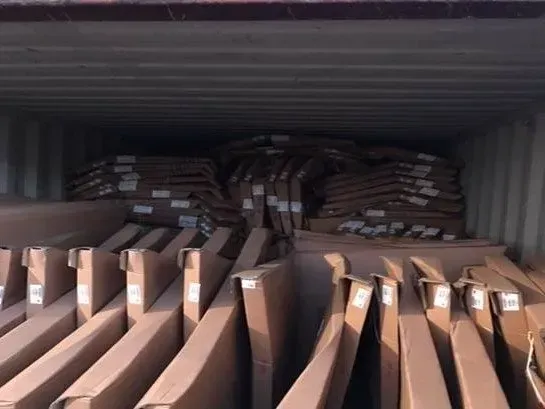 A container filled with lots of cardboard boxes
