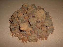 A pile of dirt is sitting on a table.
