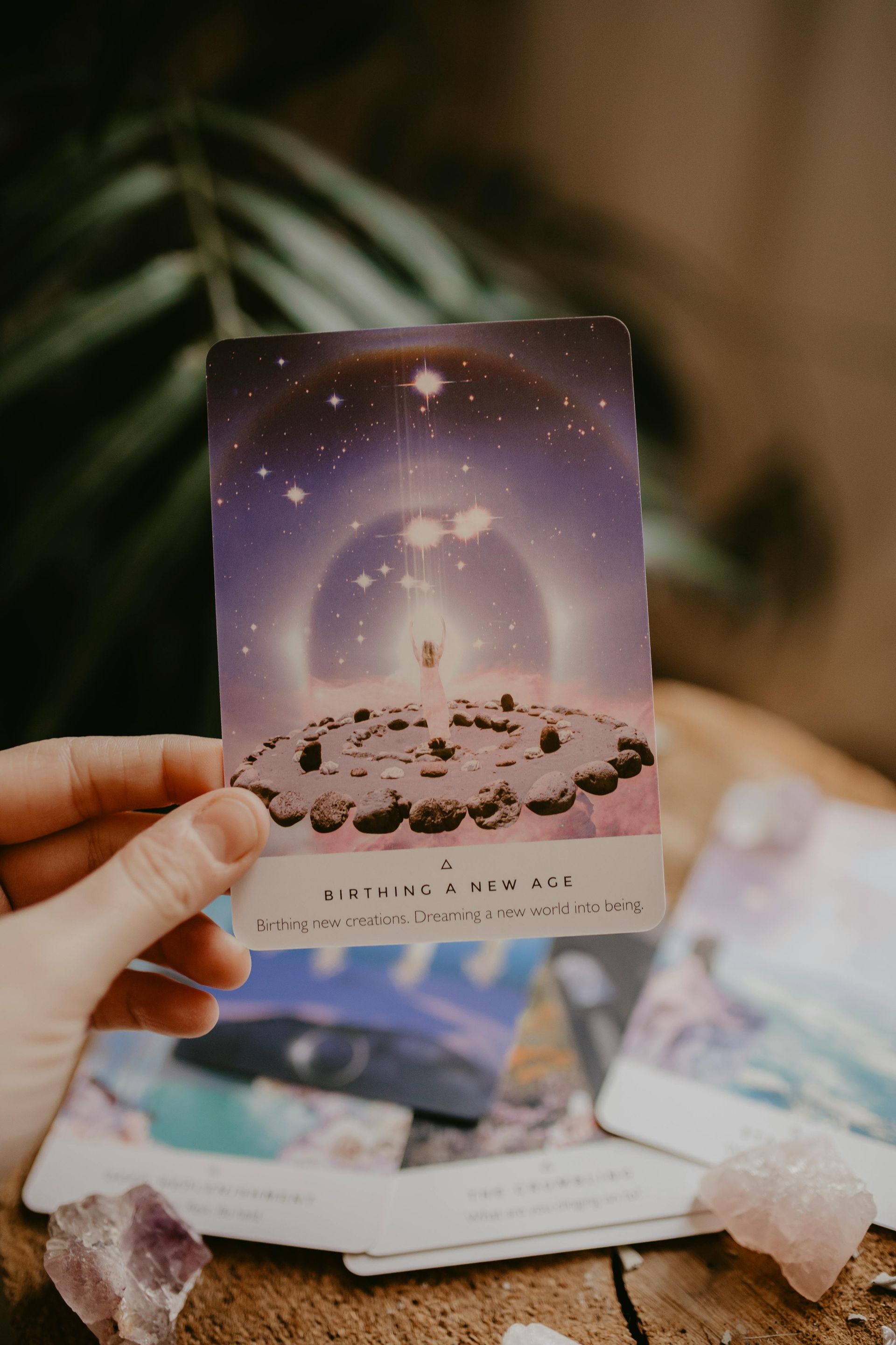 Hand holding a tarot card: