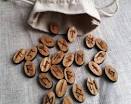 A bag filled with wooden runes is sitting on a table.