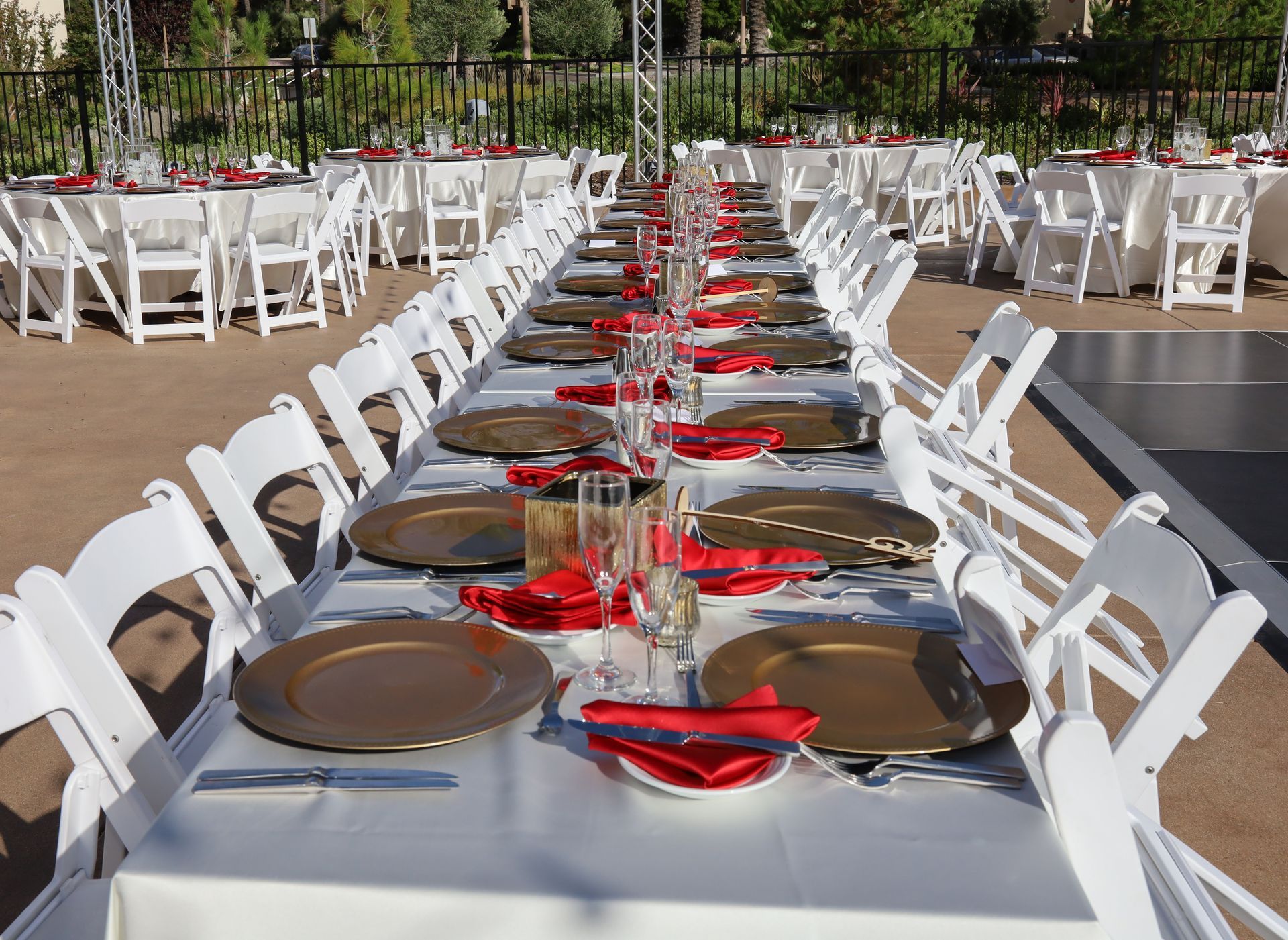 A long table with plates and glasses on it