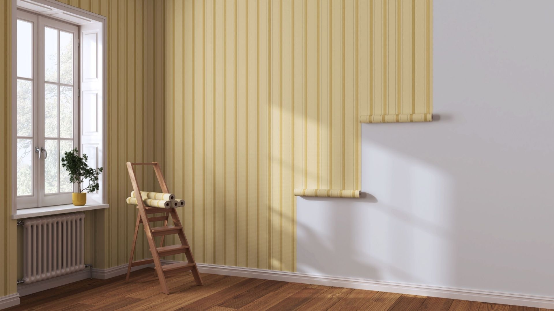 A room with a wooden floor and a ladder in it.