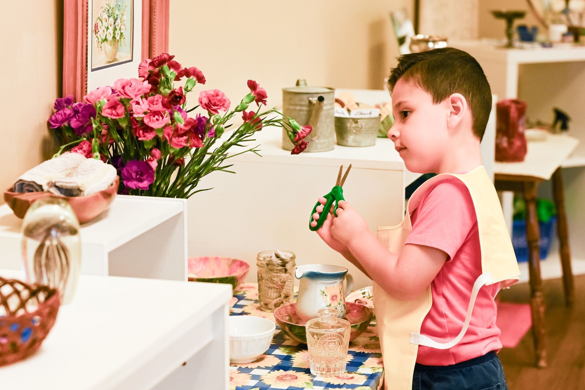 Montessori child is working on practical life skills.