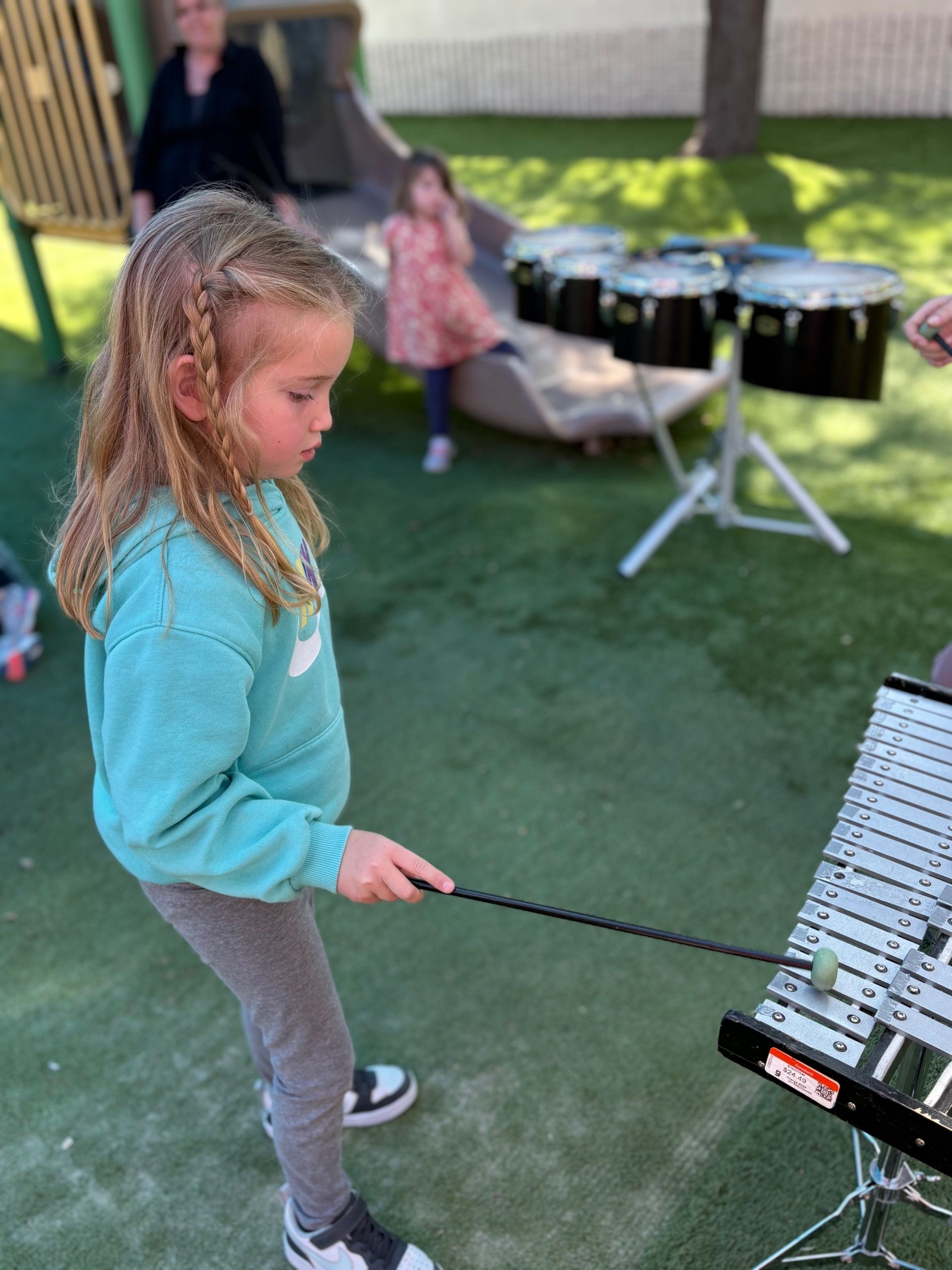 Motnessori child working with musical instrument