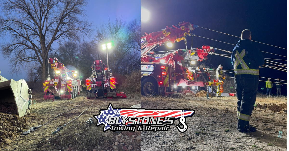Emergency personnel at night near overturned vehicles, lit by spotlights. Tow trucks and debris on dirt.