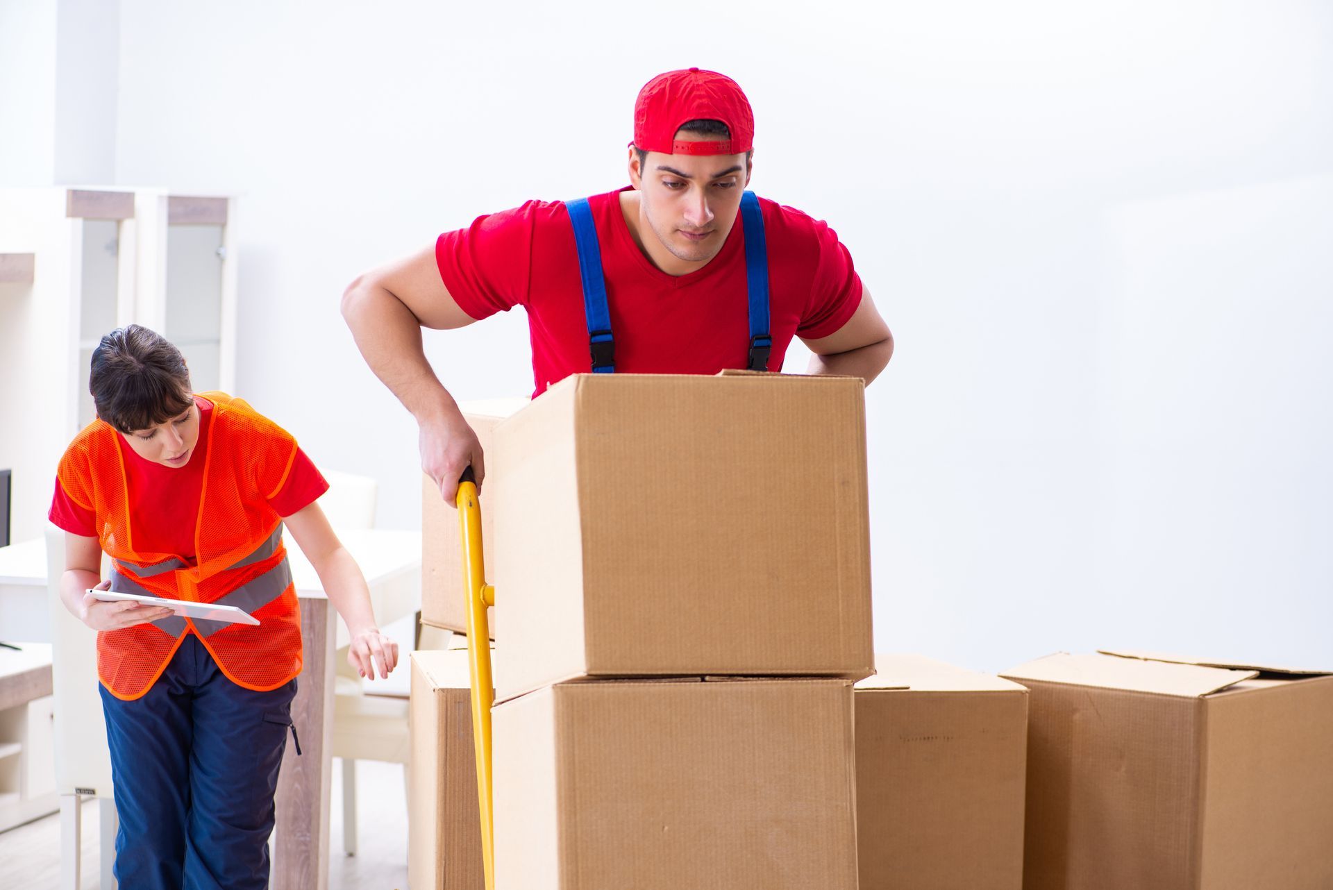 mover pushing the cart of boxes