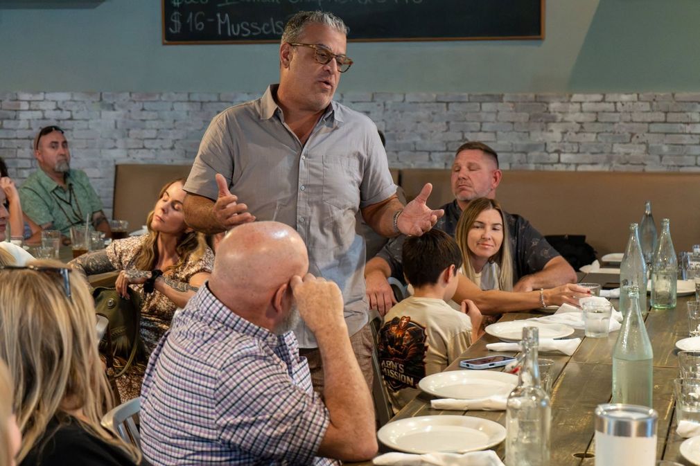 Beachside Mavericks members engaged in a collaborative business discussion