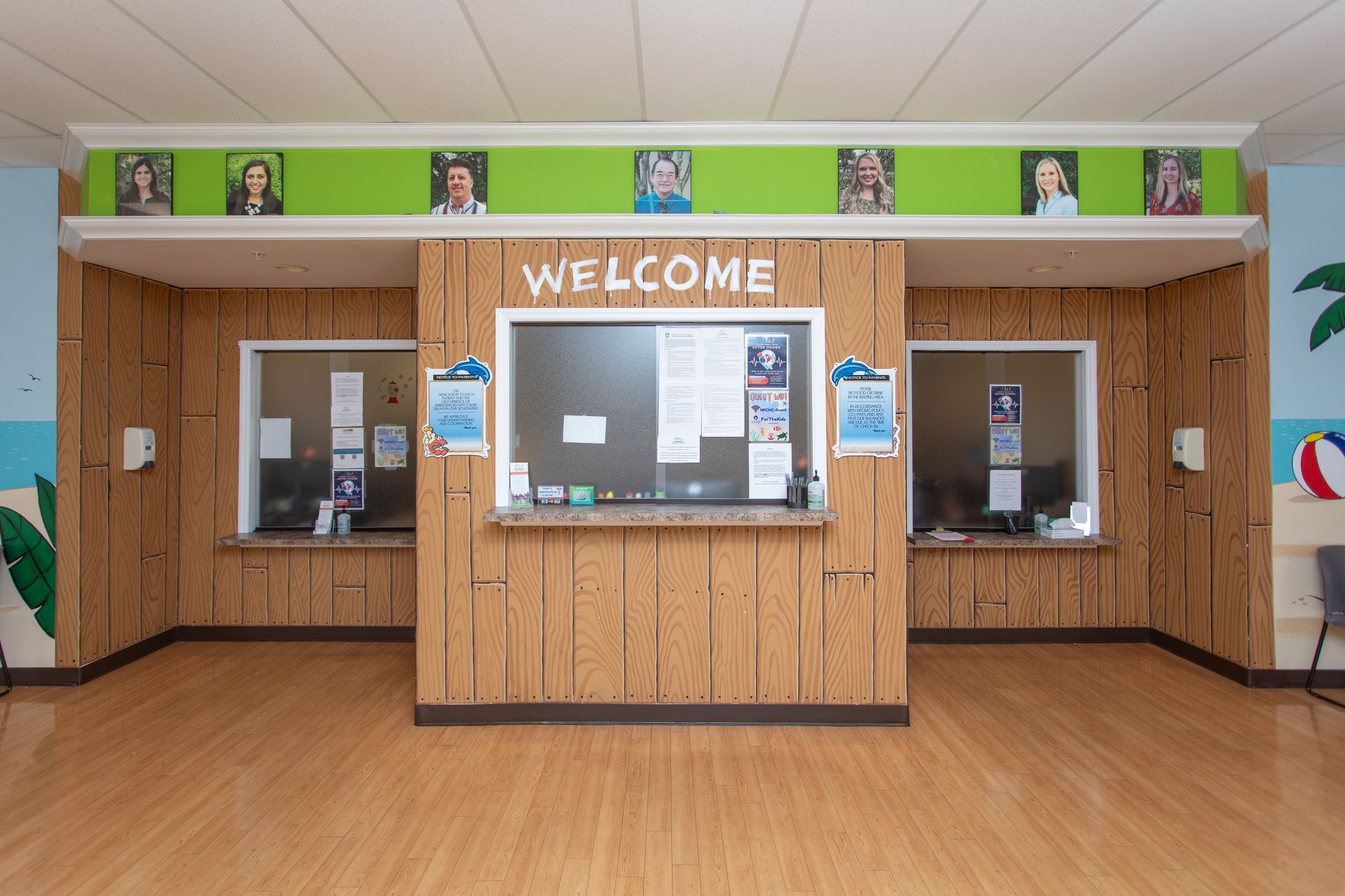 A room with wooden walls and a welcome sign on the wall.