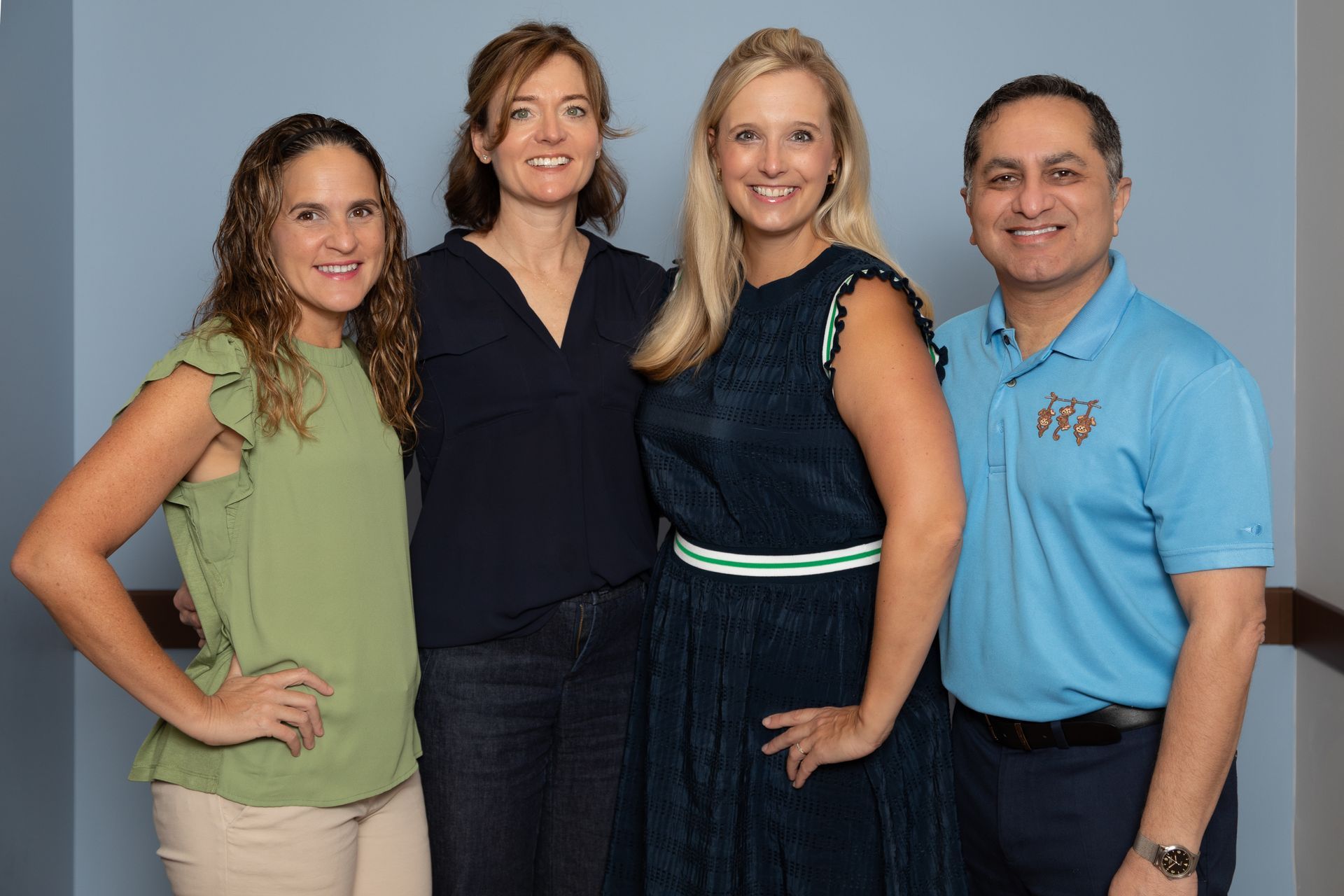 A group of people are posing for a picture together.
