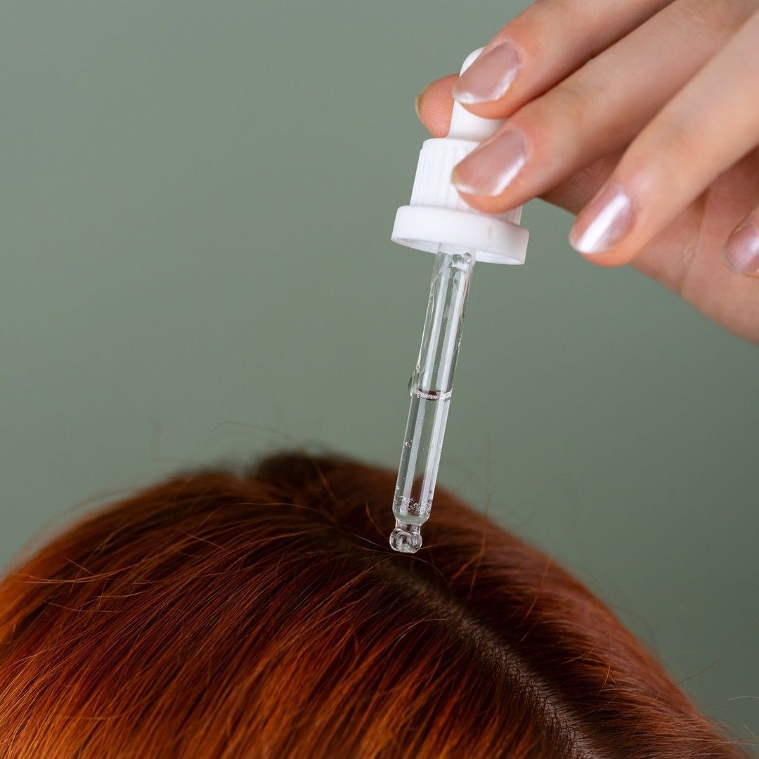 Exosome serum being applied to the scalp at Renewed Health and Wellness in Prospect, Connecticut