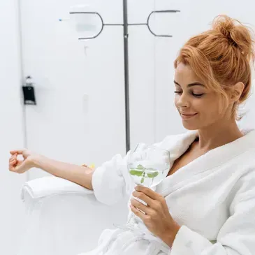 Patient receiving migraine and pain IV therapy at Renewed Health and Wellness