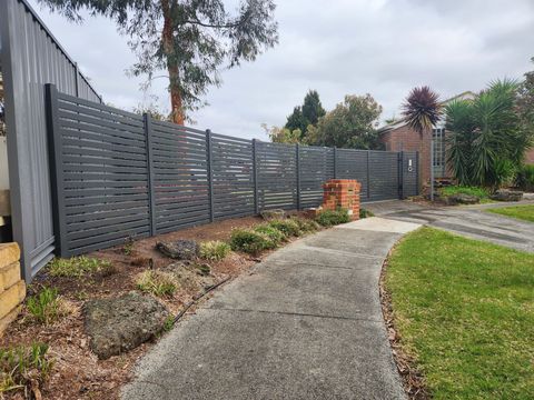 Modern aluminium slat fencing enhancing street appeal
