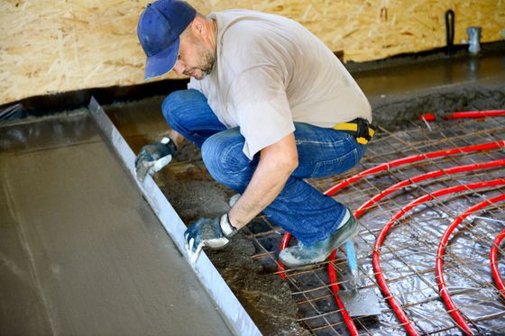 A Man Pouring Concrete Floor - Umina Beach - Stuart Concreting A Man Pouring Concrete Floor - Umina Beach - Stuart Concreting