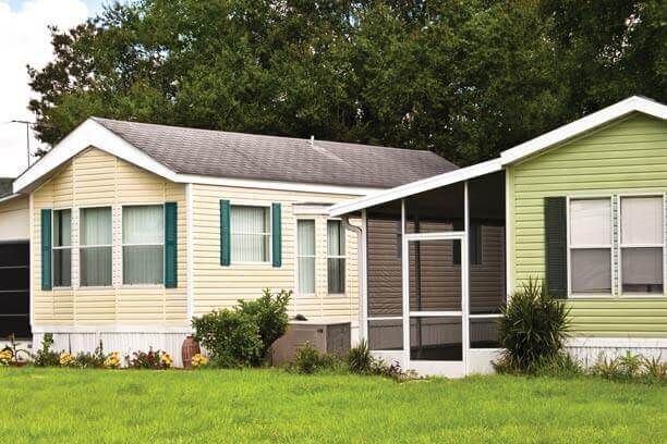 close up of pretty manufactured home with insurance