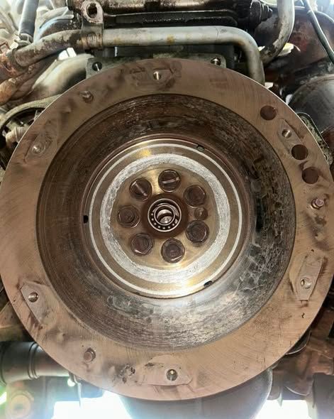 Close-up Of an Engine’s Flywheel and Clutch Assembly Inside a Vehicle Drivetrain — All Auto & Mechanical in The Entrance North, NSW