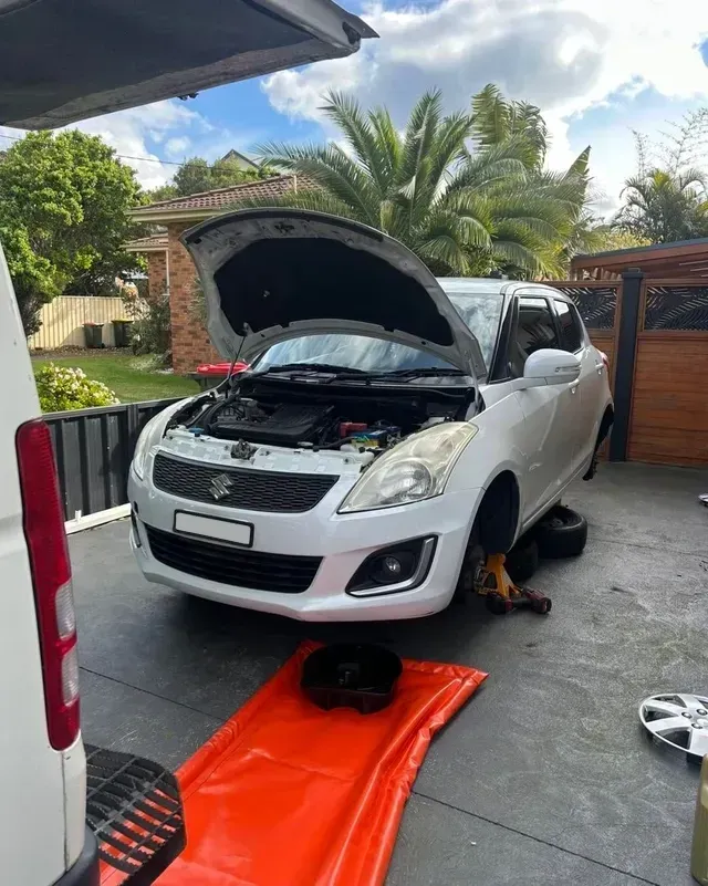 Mobile Mechanic On The Central Coast Performing A Vehicle Service At A Customer's Home Driveway — All Auto & Mechanical in The Entrance North, NSW
