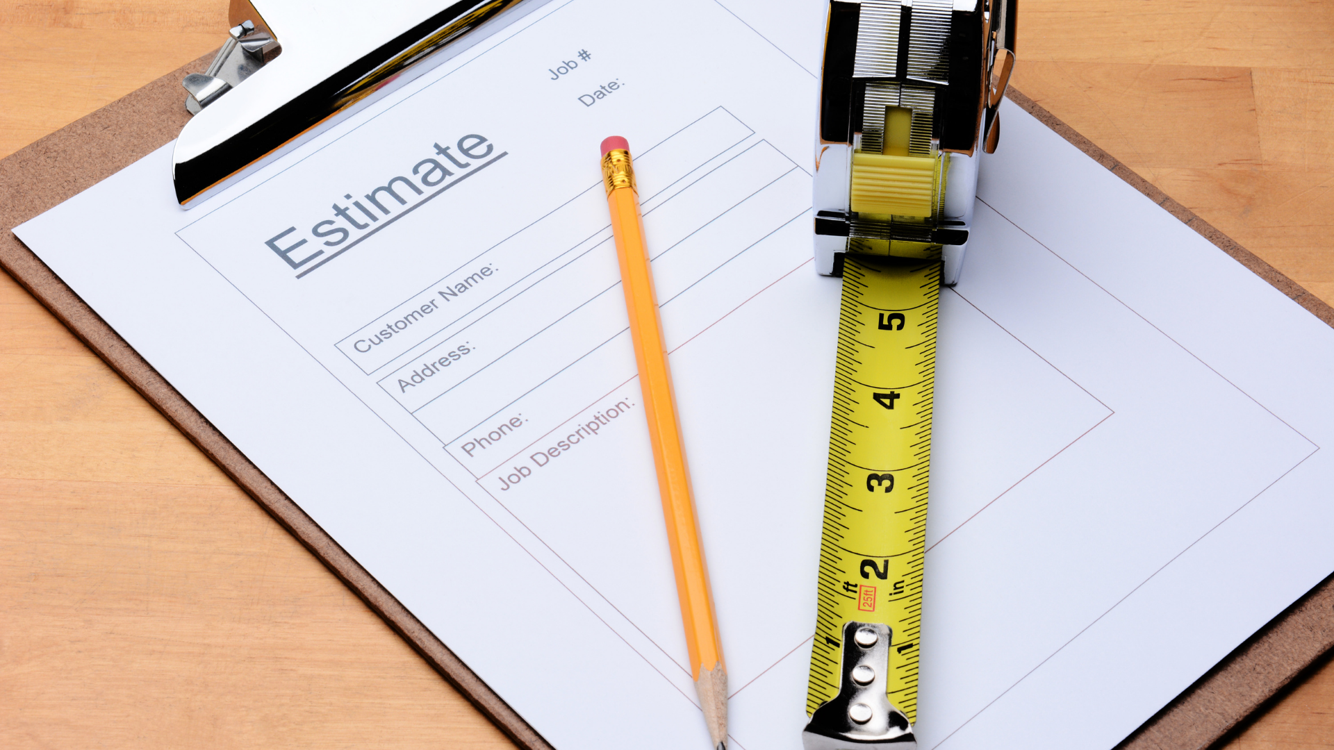 Clipboard with estimate form, pencil, and tape measure on a desk