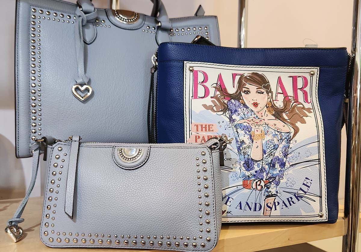 Light blue handbags and a Harper’s Bazaar magazine cover on a shelf