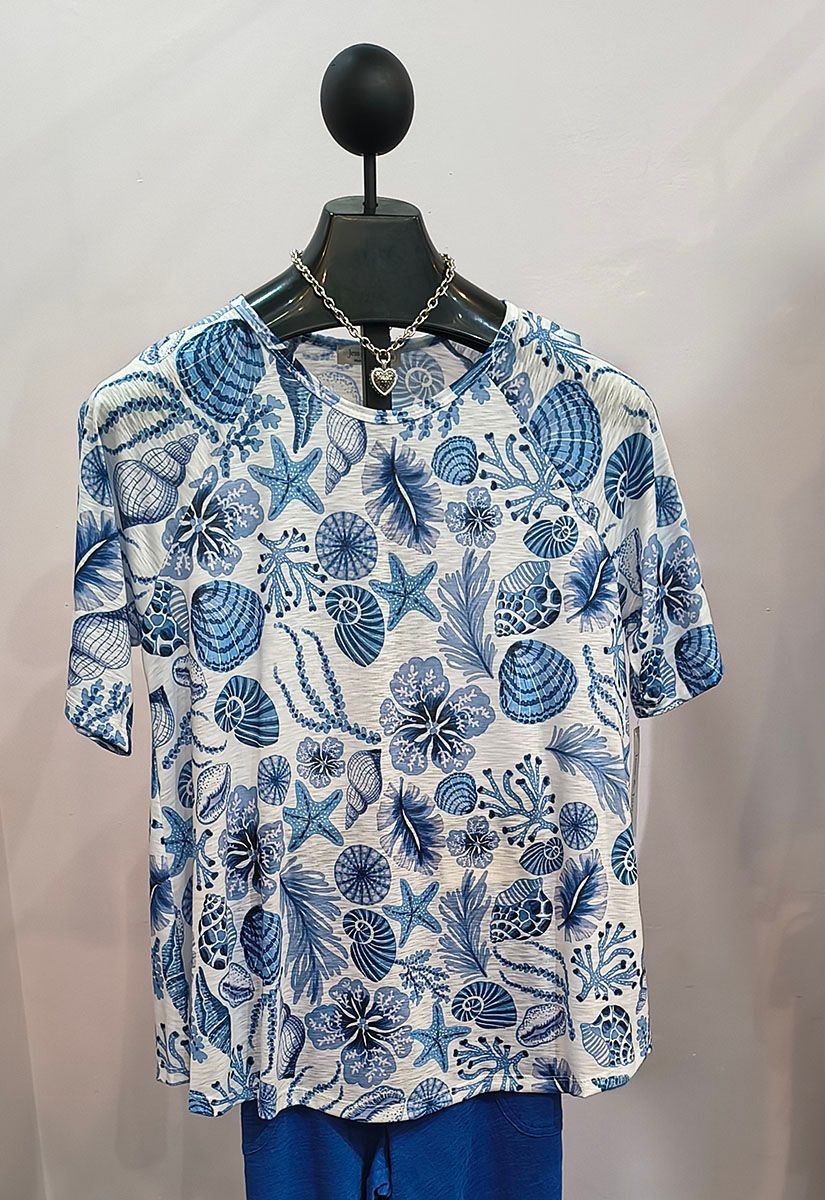 Blue and white floral short-sleeve shirt on a hanger against a plain background