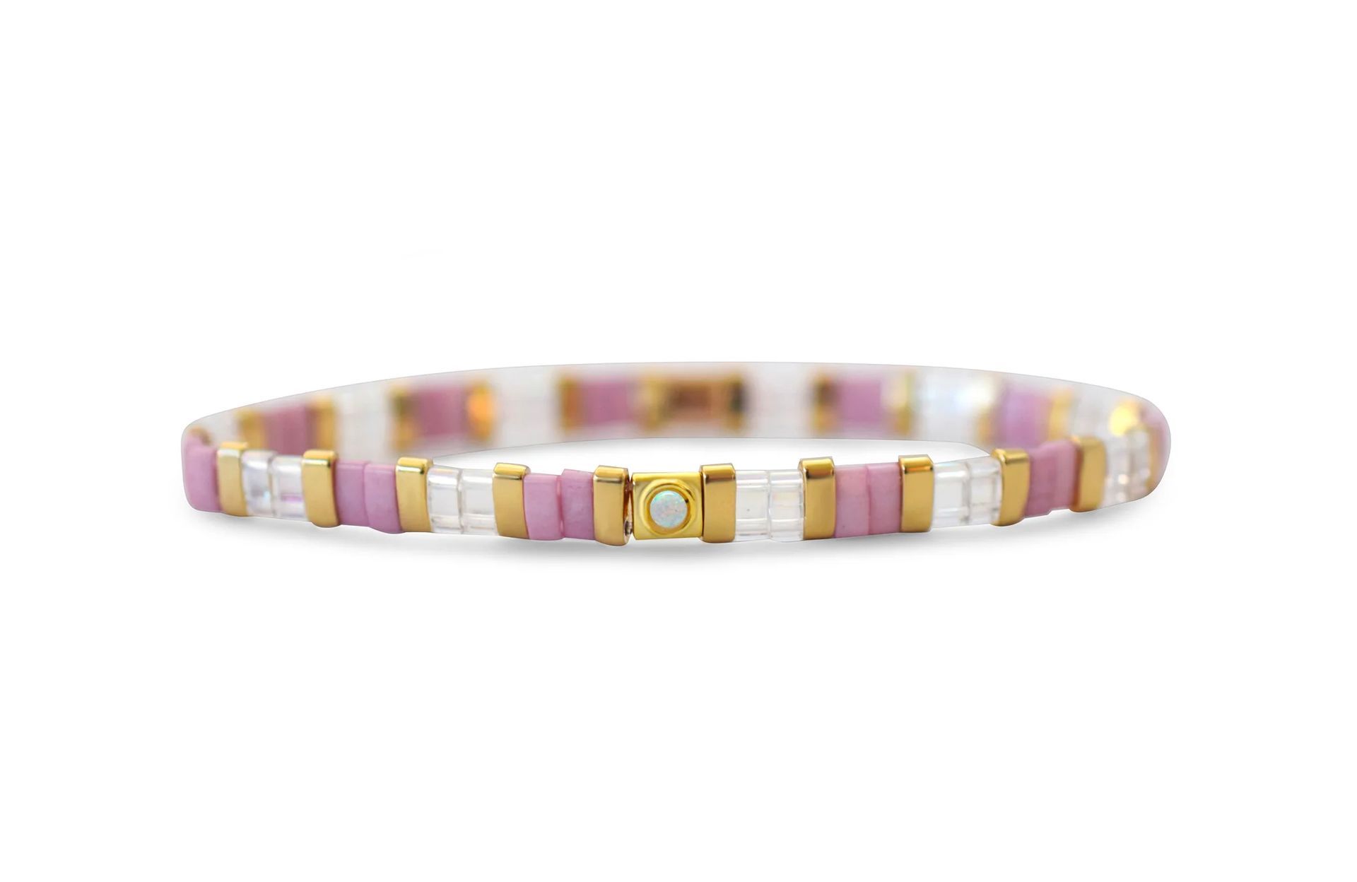 Pastel pink and gold beaded bracelet with a gold clasp on a white background