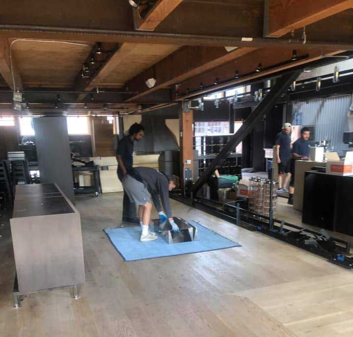 Grabbing A Thing On The Floor — Puyallup, WA — Boush Moving & Storage Inc
