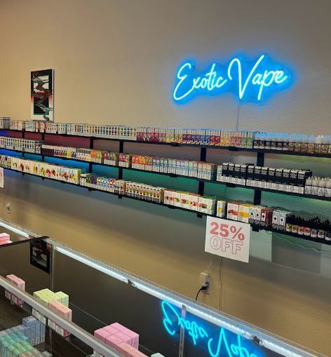 A store with a neon sign that says exotic vape