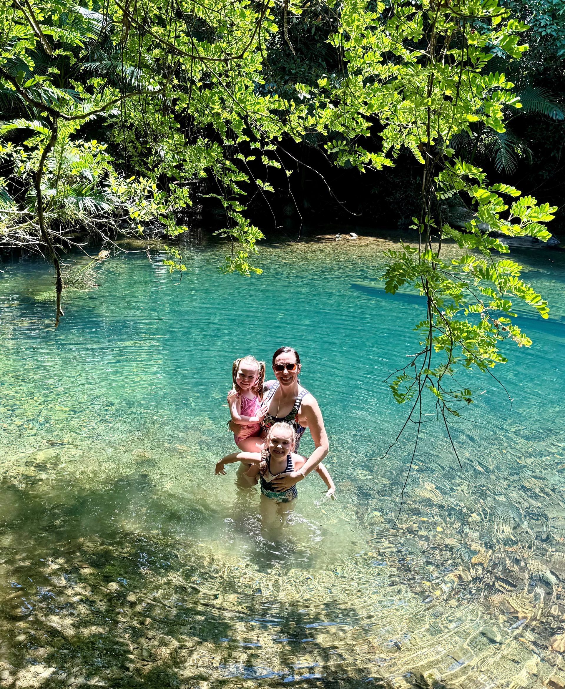 Megsi O'Toole and her daughters enjoying a freshwater rainforest swimming hole