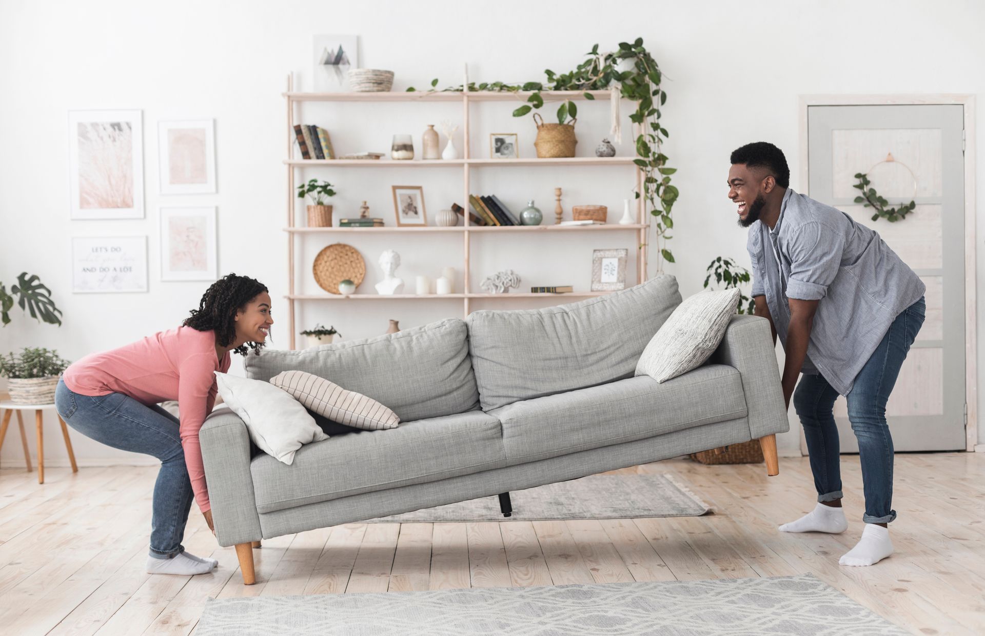 Living room with couch, couple moving