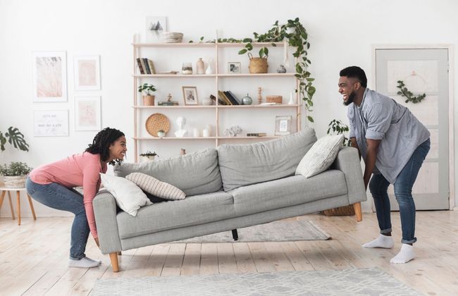 Living room with couch, couple moving