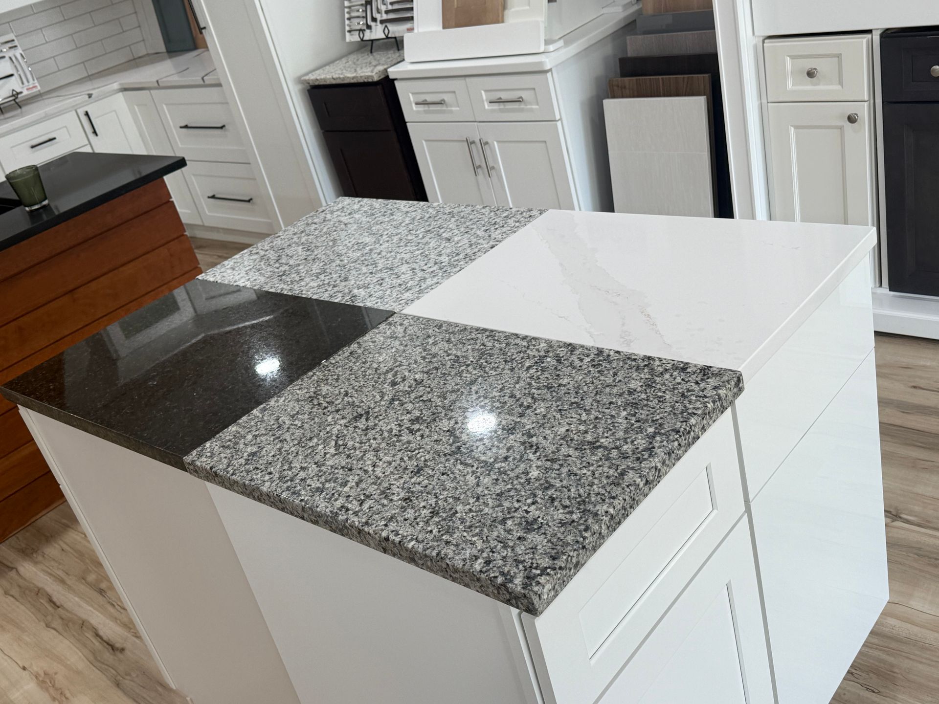 Light and dark countertop samples displayed together in Darlington’s Pawtucket showroom
