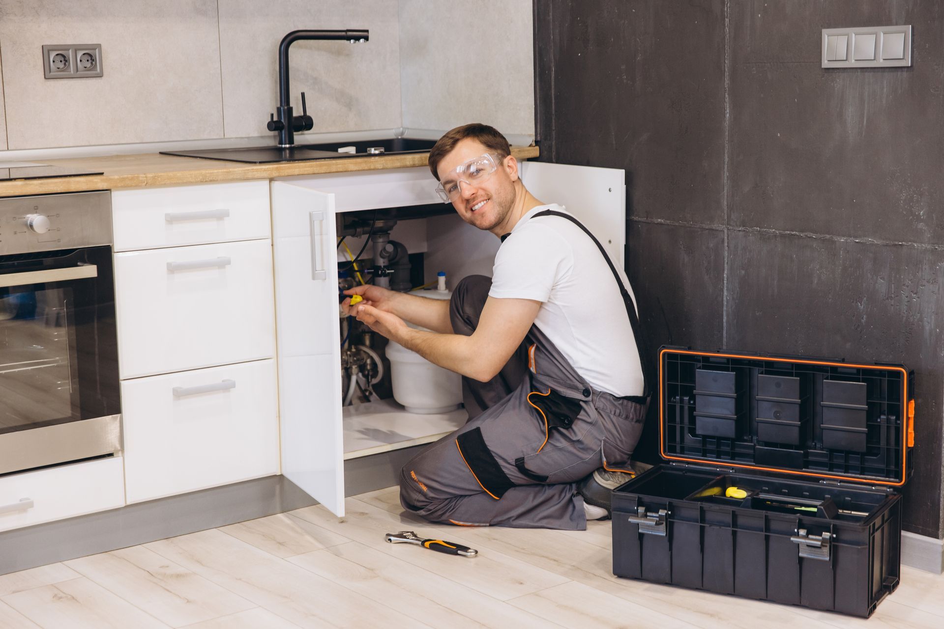 Plumber Fixing A Sink