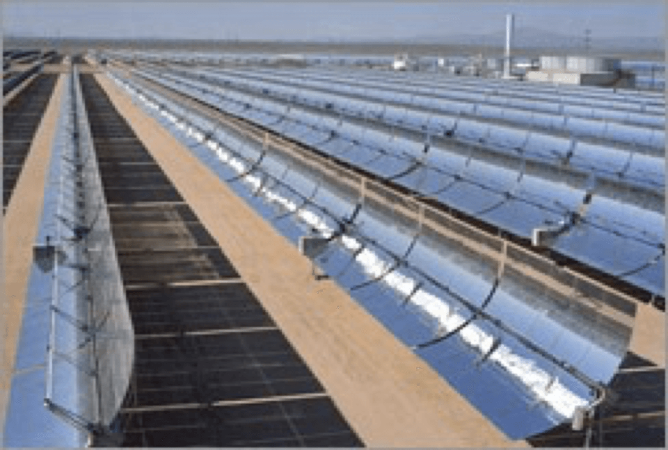 a row of solar panels are lined up in a field