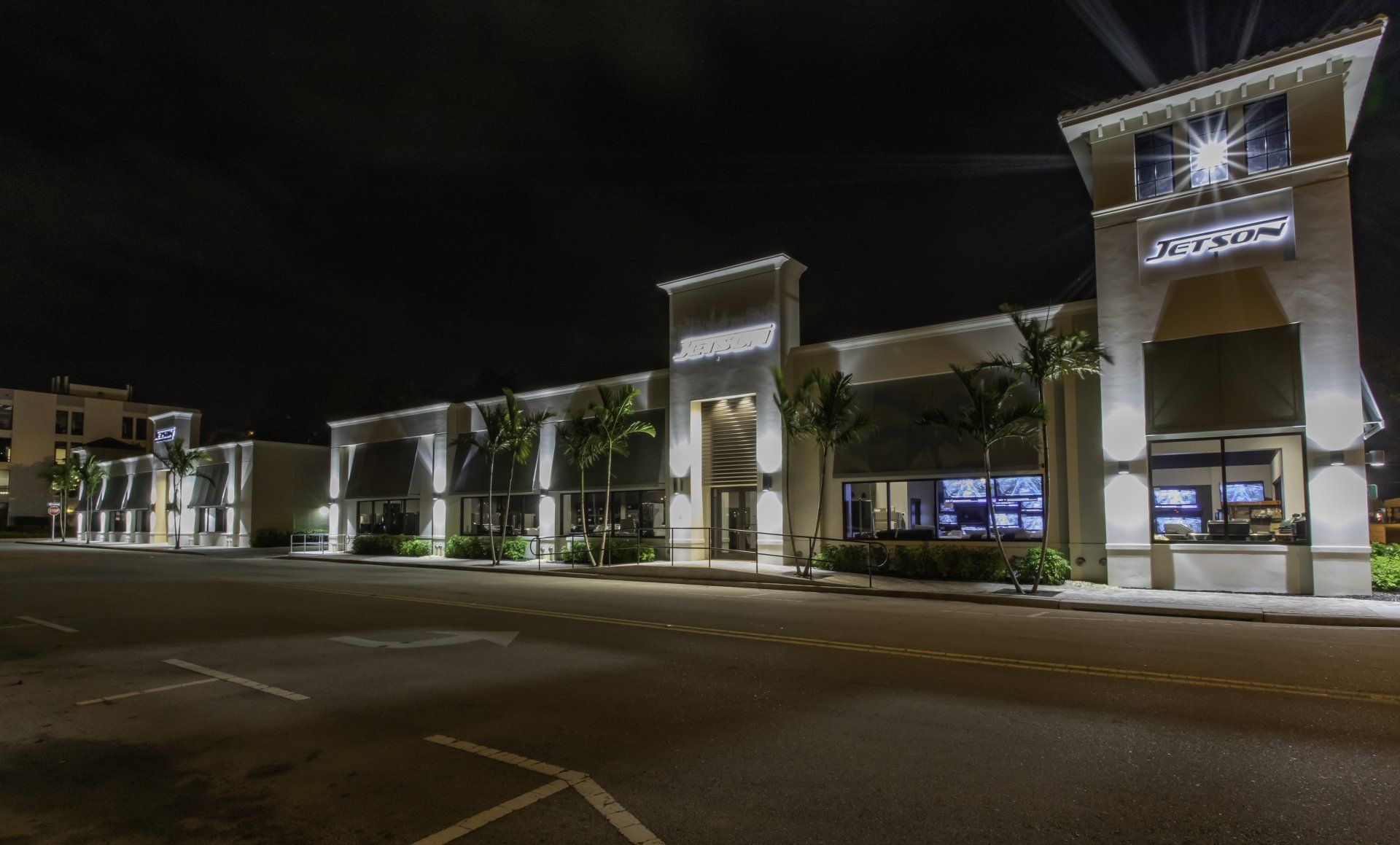 a large building with a lot of windows is lit up at night .