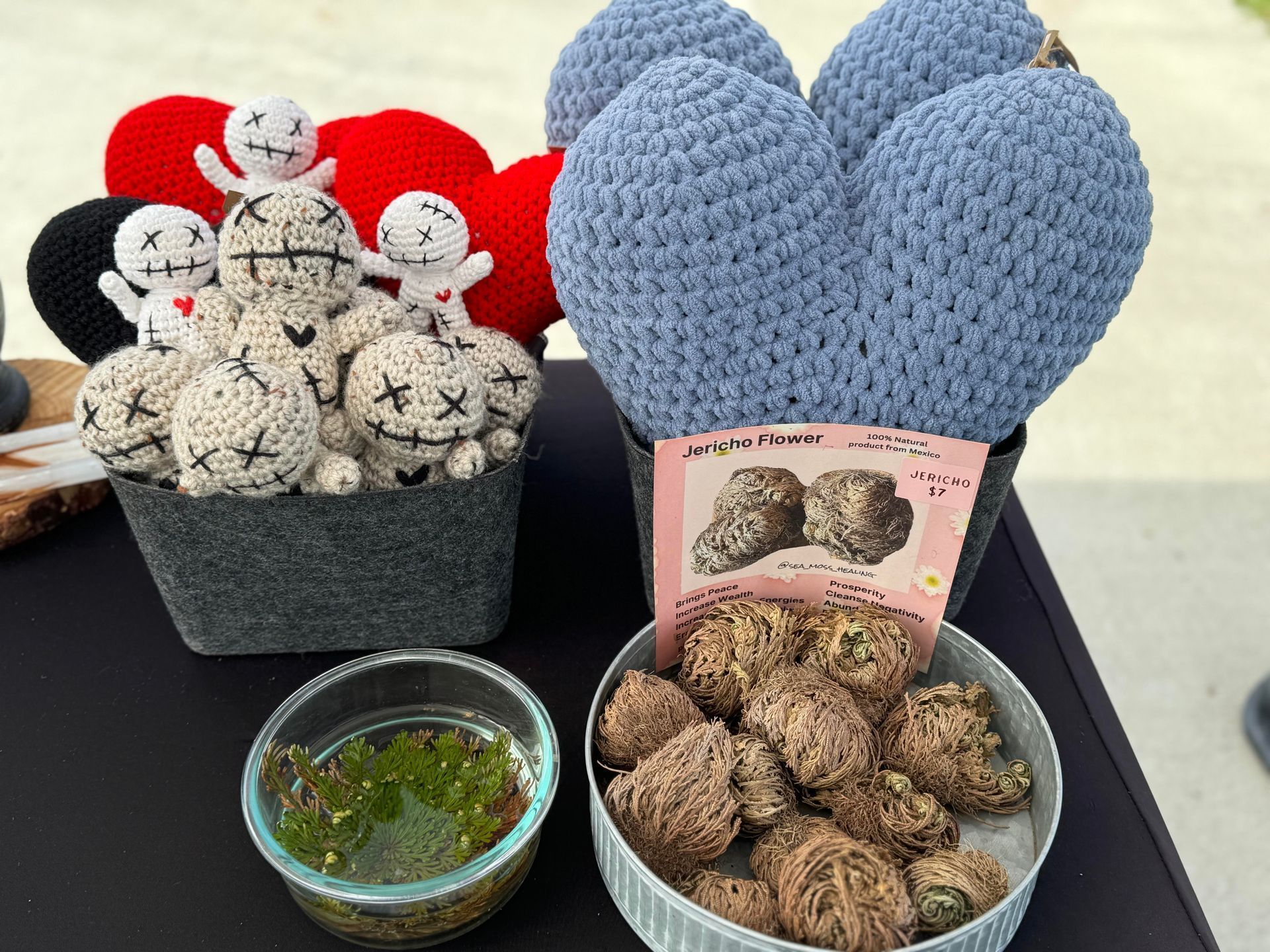 A table topped with bowls of food and crocheted hearts.