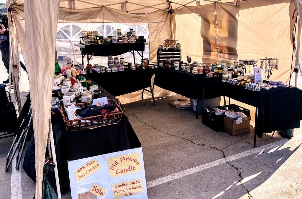 A tent filled with tables and product.