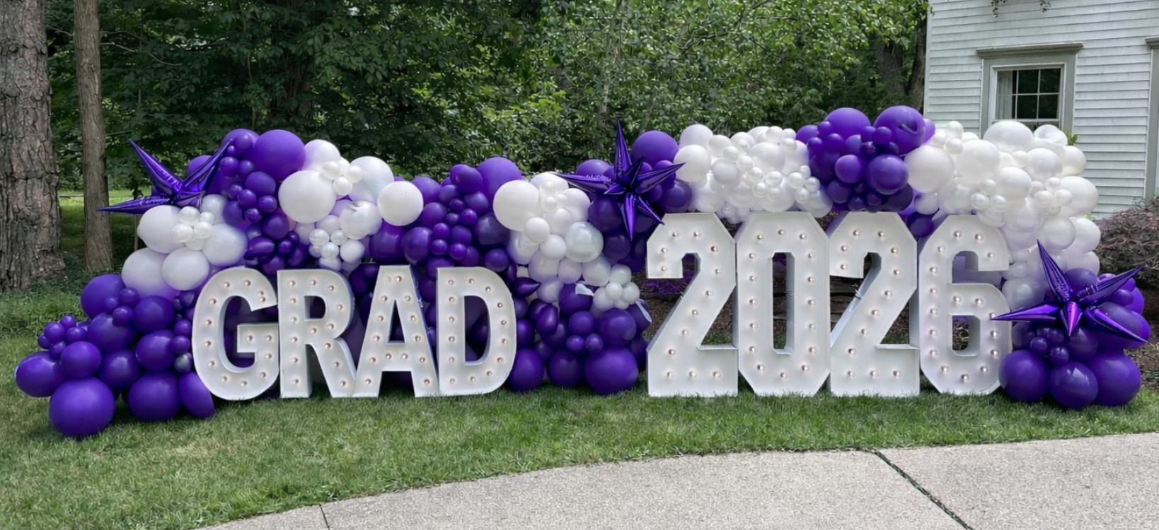 Marquee letters GRAD 2026 with balloon garland for graduation party decor in Fort Worth DFW area