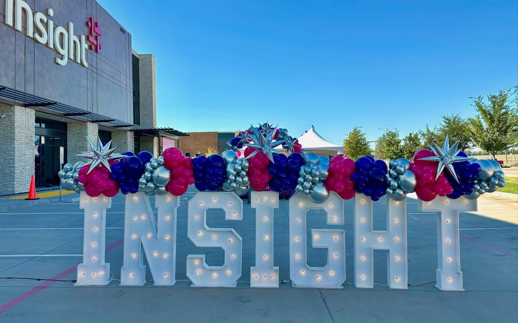 Custom marquee letters spelling INSIGHT for corporate event with balloon decor outside venue in DFW