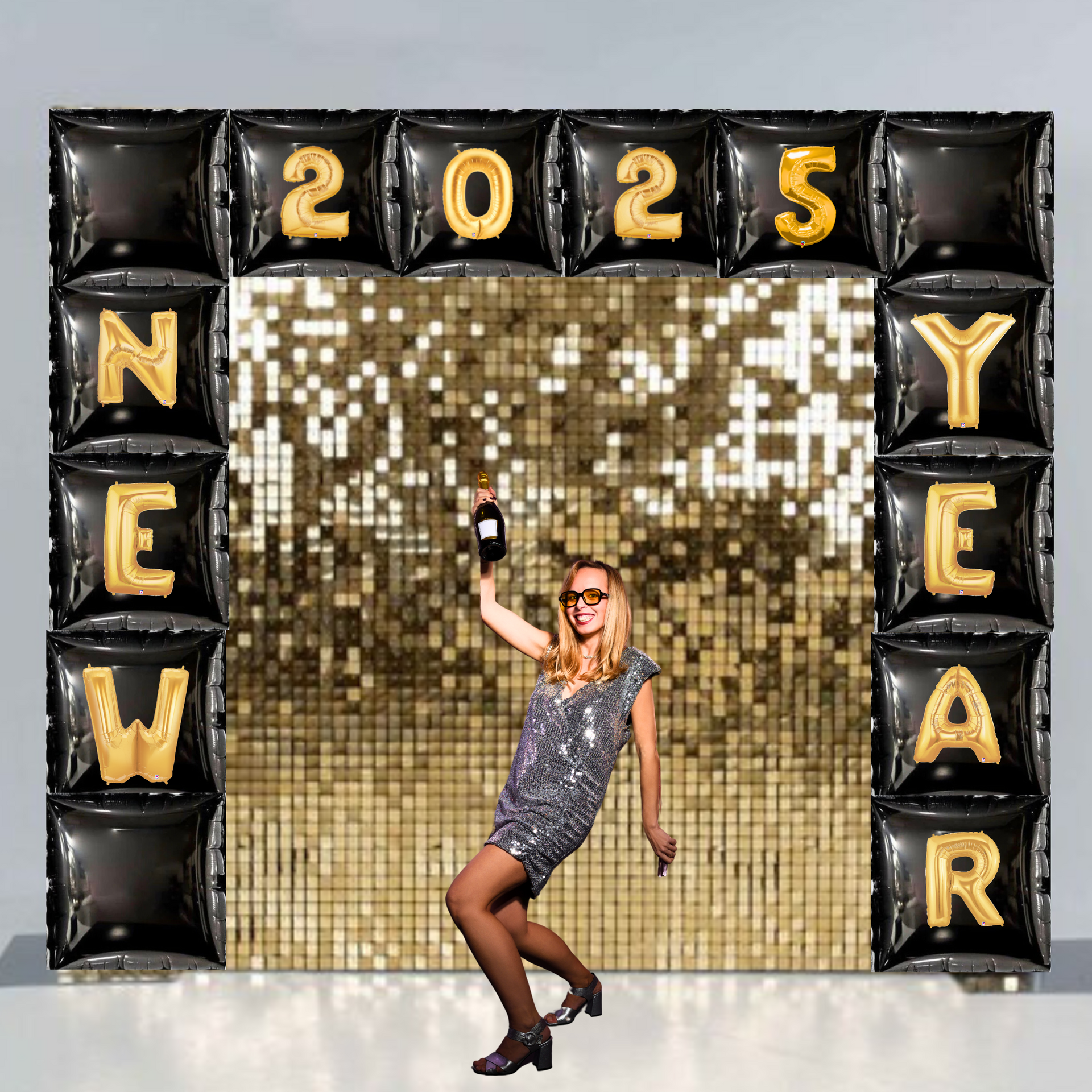 New Year’s 2025 balloon arch featuring black and gold balloons with a shimmer backdrop