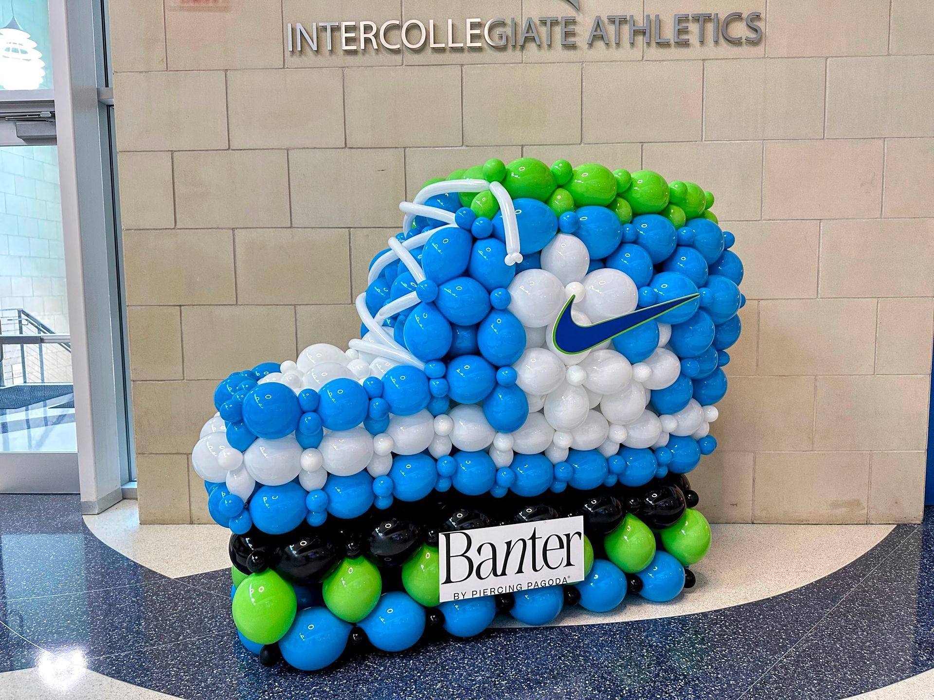 A shoe made out of balloons with the name baniter on it
