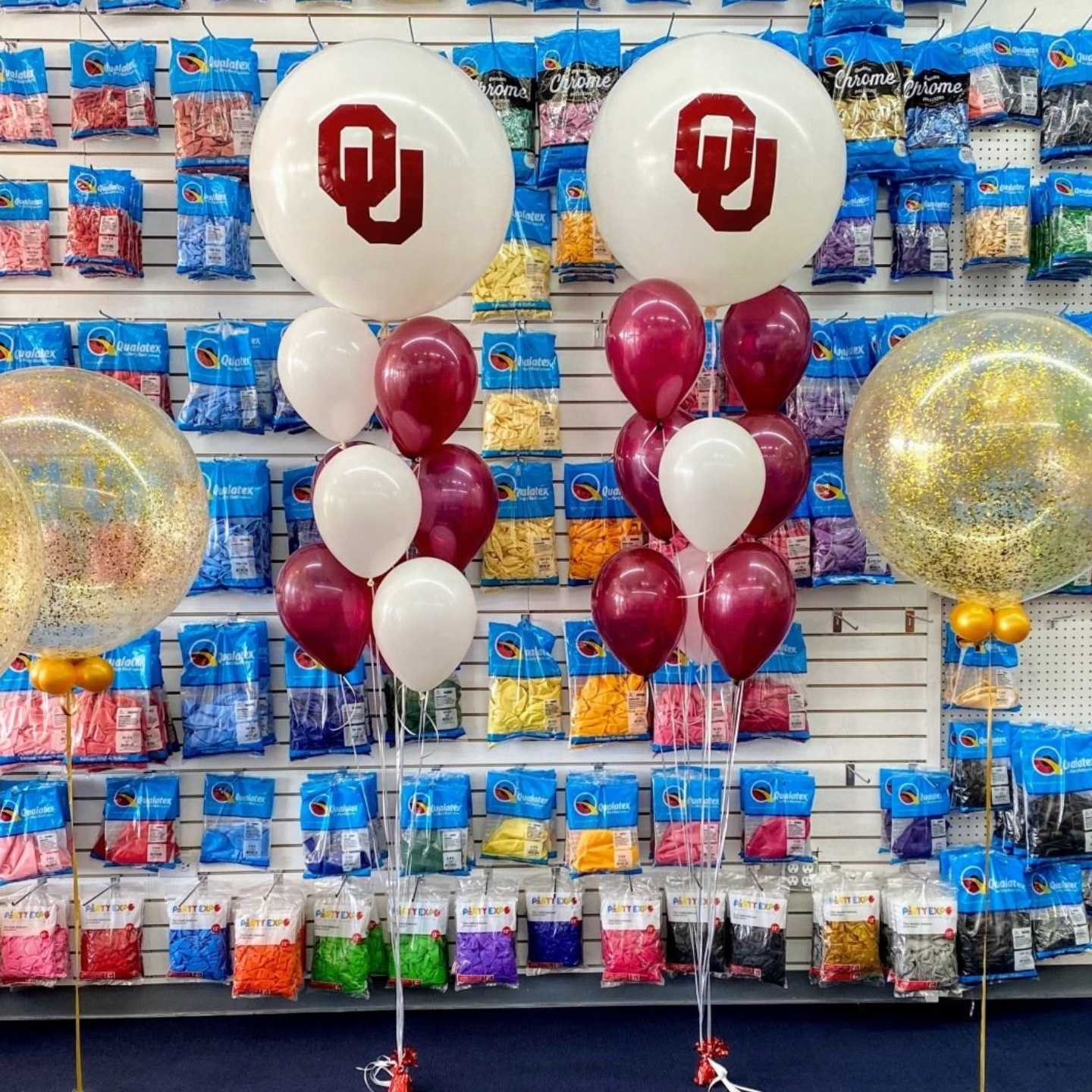 Custom helium balloon bouquet with OU logo balloons for school event or graduation party in Fort Worth