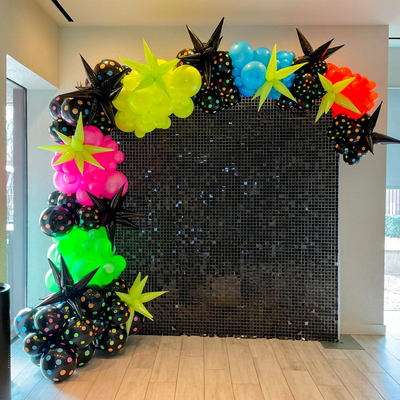 Custom event backdrop with balloon decor and themed design for party setup in Fort Worth Texas