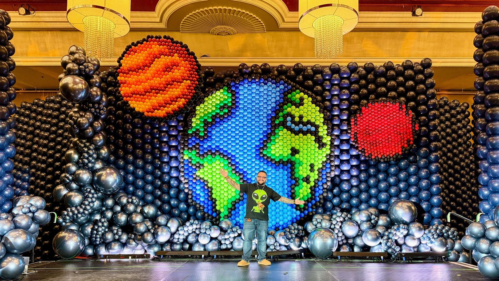 Large custom space themed balloon wall backdrop installation for event in Fort Worth Texas